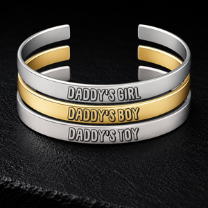 Silver and gold BDSM cuff bracelets engraved with Daddy’s Girl, Daddy’s Boy and Daddy’s Toy, adjustable 8mm stainless steel Daddy dynamic jewellery from FETBOMB.