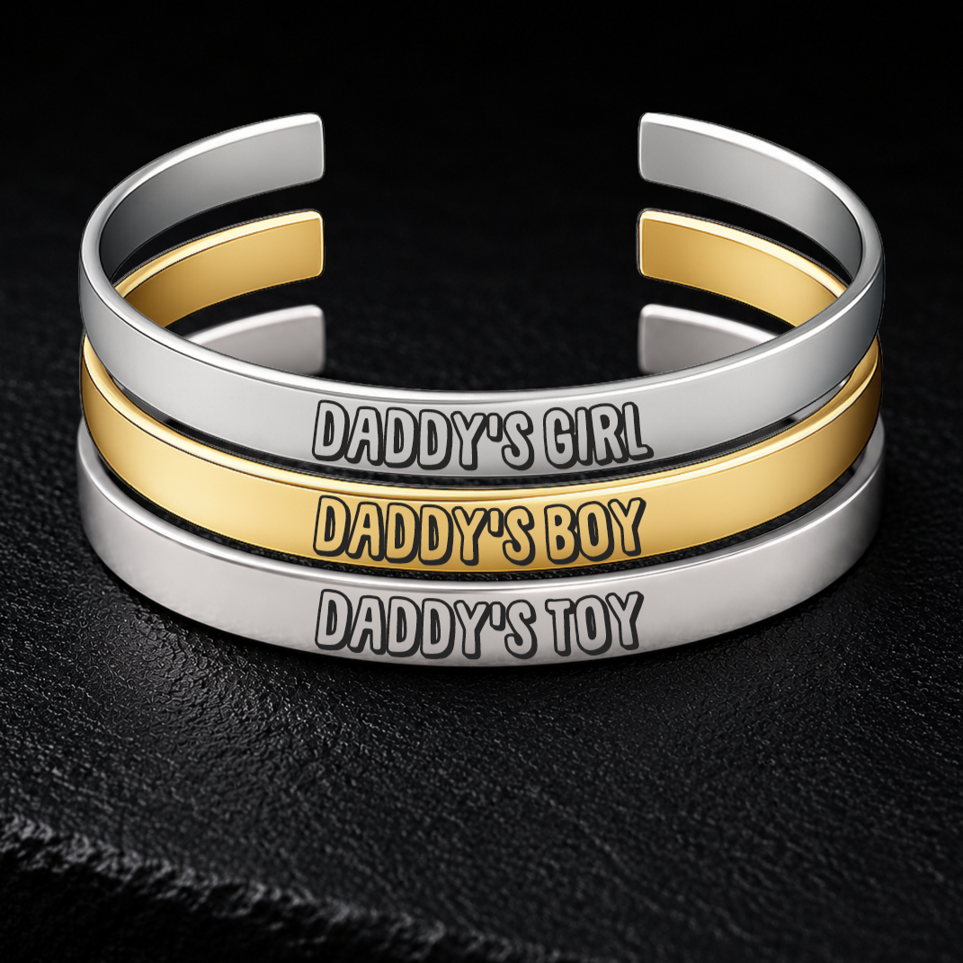 Silver and gold BDSM cuff bracelets engraved with Daddy’s Girl, Daddy’s Boy and Daddy’s Toy, adjustable 8mm stainless steel Daddy dynamic jewellery from FETBOMB.